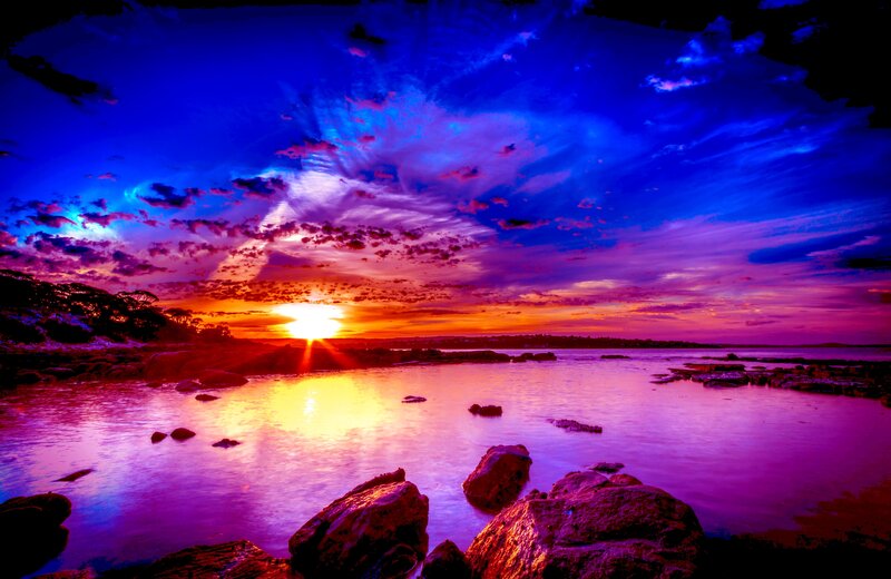 Sunset over Rocky Shore — Blue, Dramatic, Photograph, Sun, Rocks, Clouds