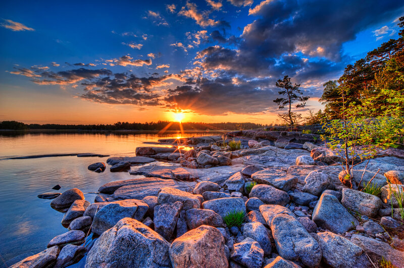 Sunset over Rocky Shore — Blue, Dramatic, Photograph, Sun, Rocks, Trees