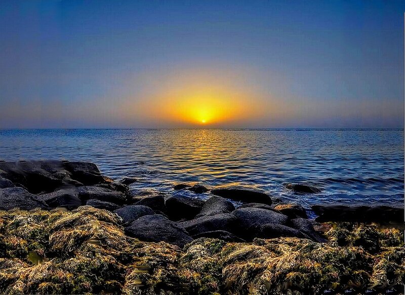 Sunset over Rocky Shore — Blue, Serene, Photograph, Sun
