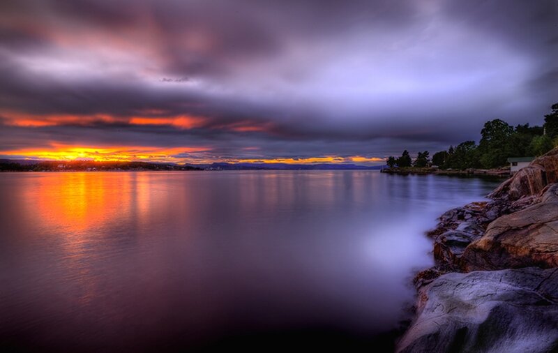 Sunset over Rocky Shore — Orange, Dramatic, Photograph, Clouds