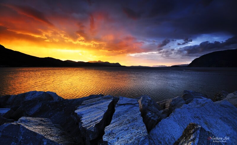 Sunset over Rocky Shore — Orange, Dramatic, Photograph, Mountains