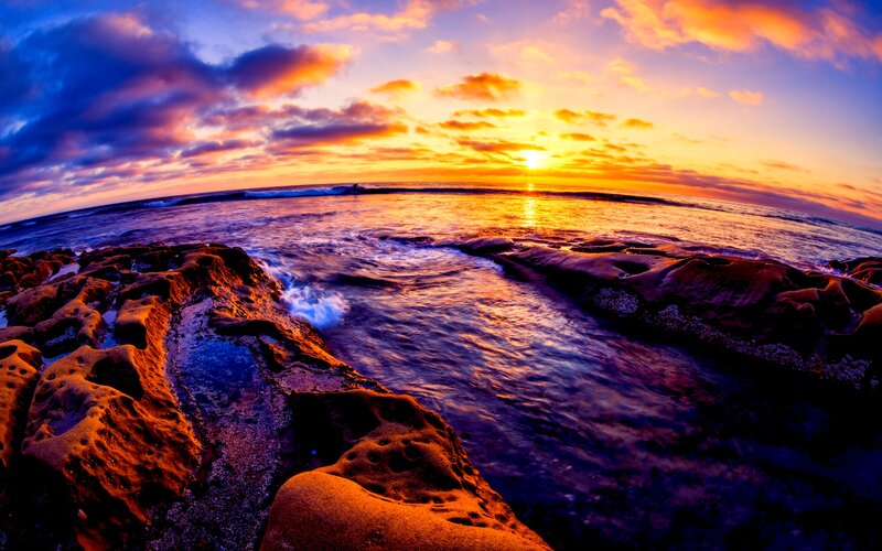 Sunset over Rocky Shore — Orange, Dramatic, Photograph, Ocean, Clouds