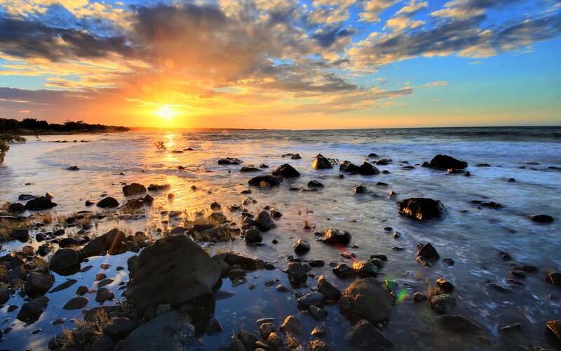 Sunset over Rocky Shore — Orange, Dramatic, Photograph, Rocks, Ocean, Clouds, Sun