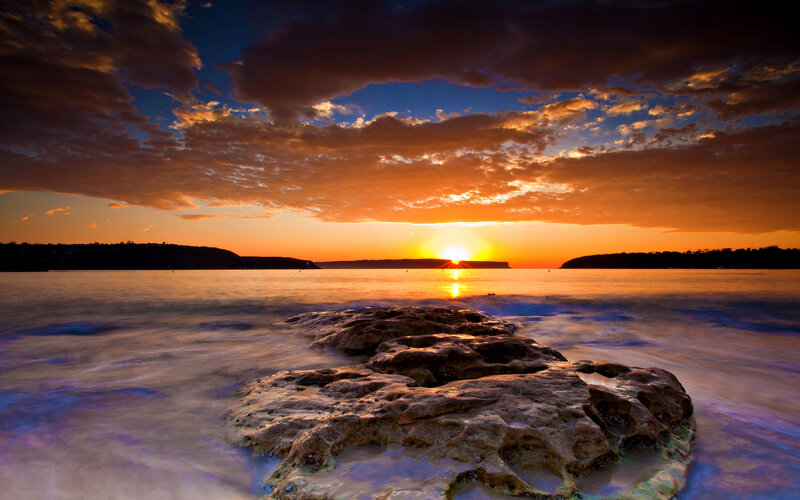 Sunset over Rocky Shore — Orange, Dramatic, Photograph, Rocks, Ocean, Clouds