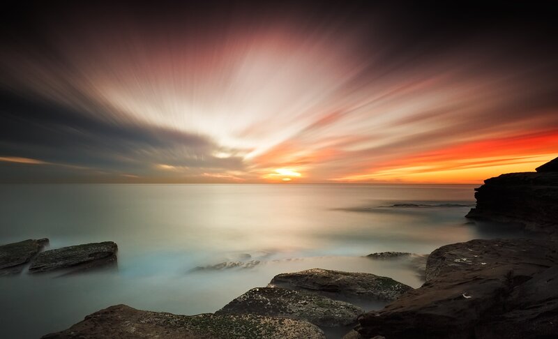 Sunset over Rocky Shore — Orange, Dramatic, Photograph, Rocks, Ocean