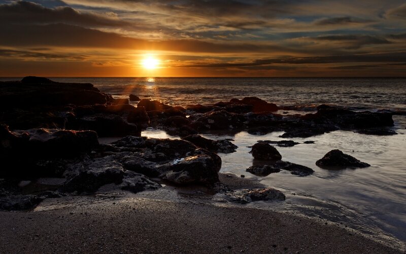 Sunset over Rocky Shore — Orange, Dramatic, Photograph, Sun, Ocean, Rocks, Sand
