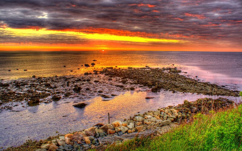 Sunset over Rocky Shore — Orange, Dramatic, Photograph