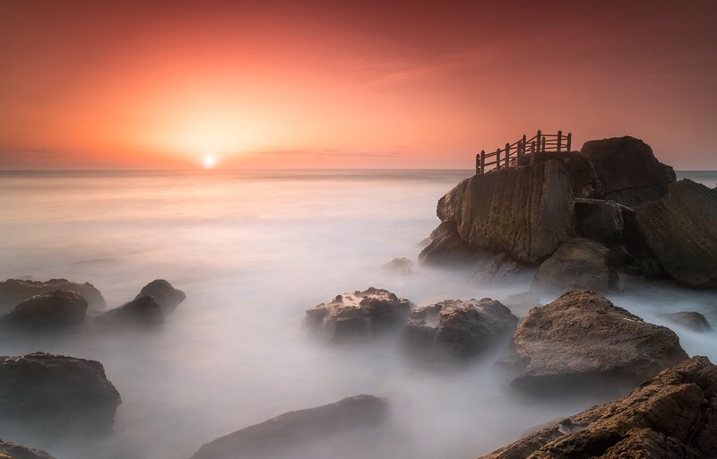 Sunset over Rocky Shore — Orange, Serene, Photograph, Rocks, Ocean, Sun