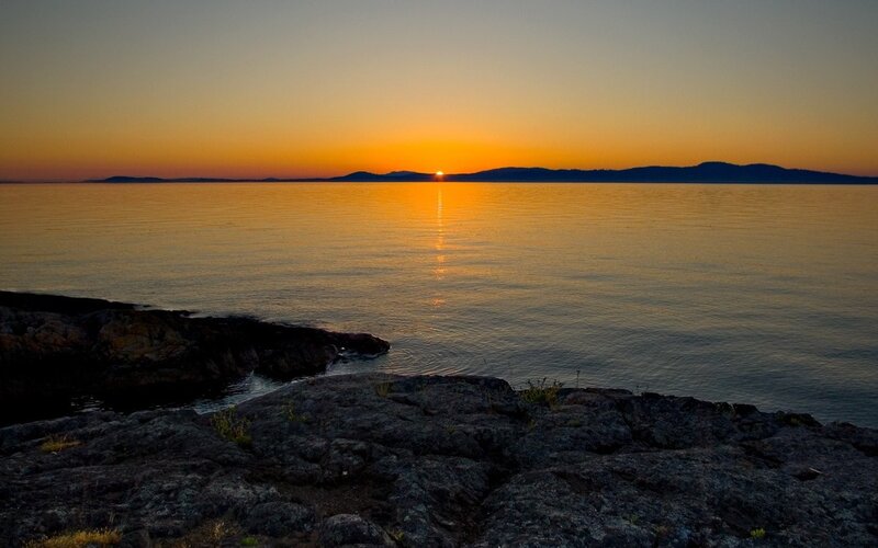 Sunset over Rocky Shore — Orange, Serene, Photograph, Sun, Sea