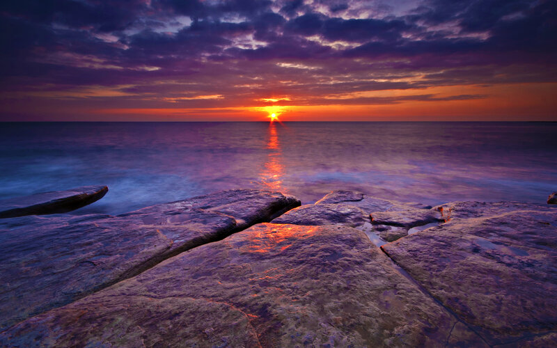 Sunset over Rocky Shore — Purple, Dramatic, Photograph, Sun
