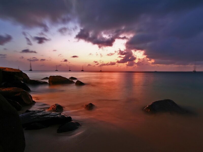 Sunset over Rocky Shore — Purple, Serene, Photograph, Boats, Clouds