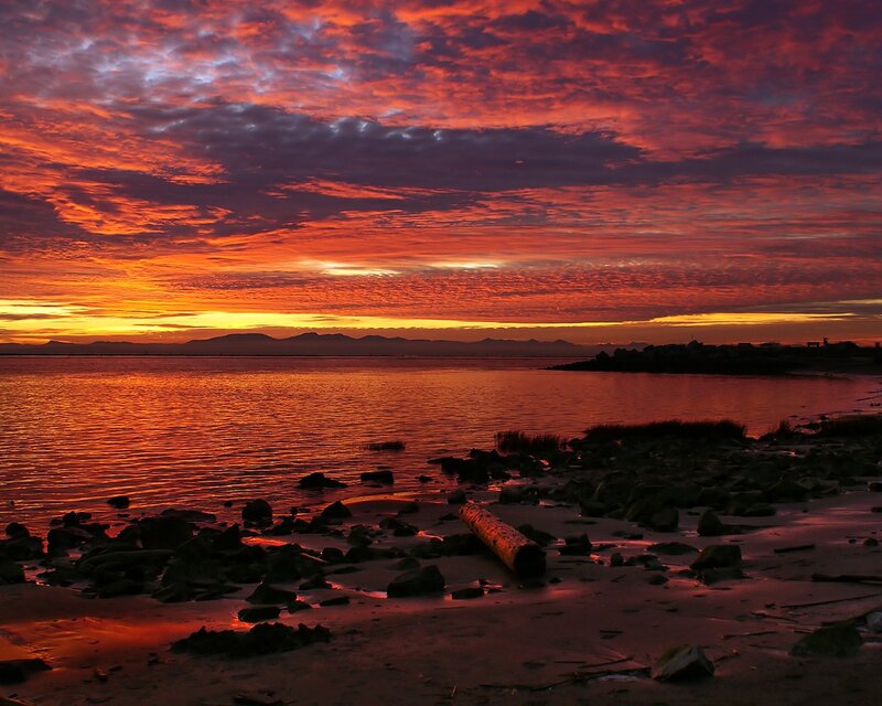 Sunset over Rocky Shore — Red, Dramatic, Photograph, Mountains, Water