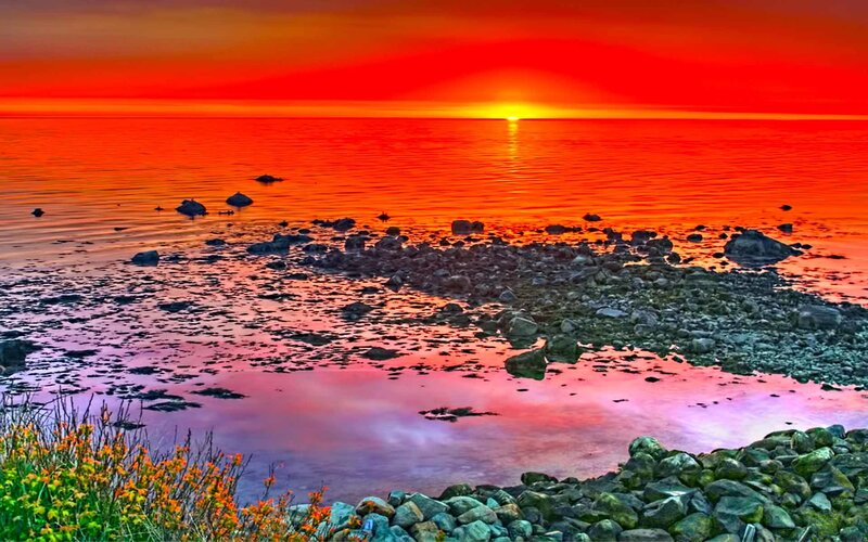 Sunset over Rocky Shore — Red, Dramatic, Photograph, Rocks, Water