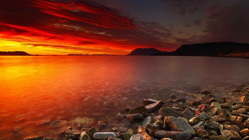 Sunset over Rocky Shore — Red, Dramatic, Photograph, Sky