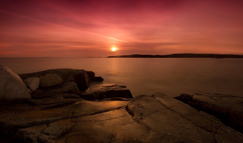 Sunset over Rocky Shore — Red, Serene, Photograph