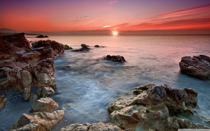 Sunset over Rocky Shore — Red, Serene