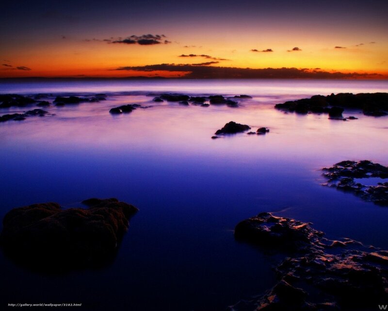 Sunset over rocky shore