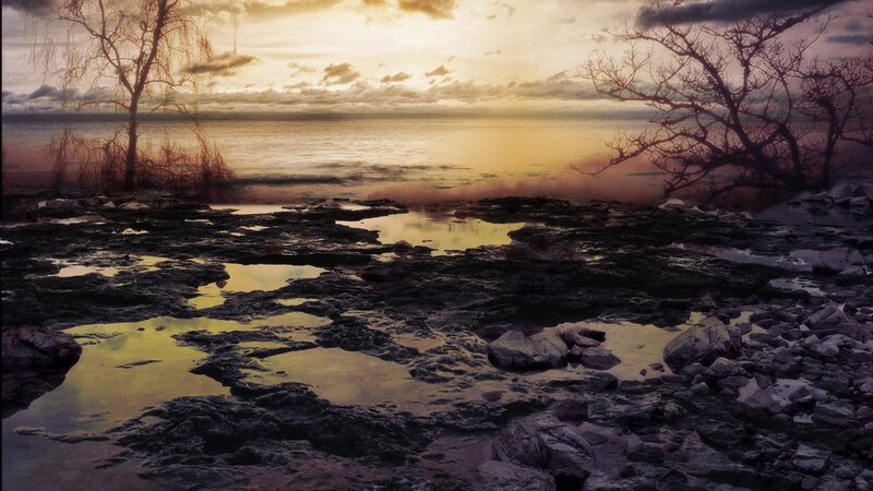 Sunset over rocky shoreline