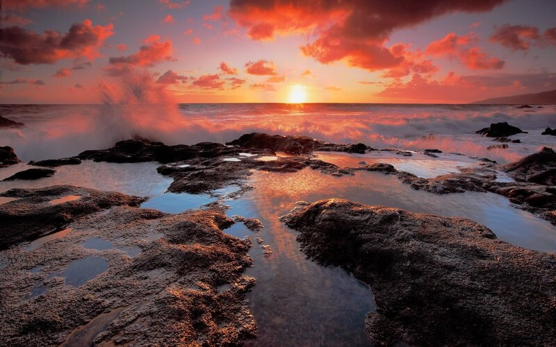 Sunset over rocky shoreline