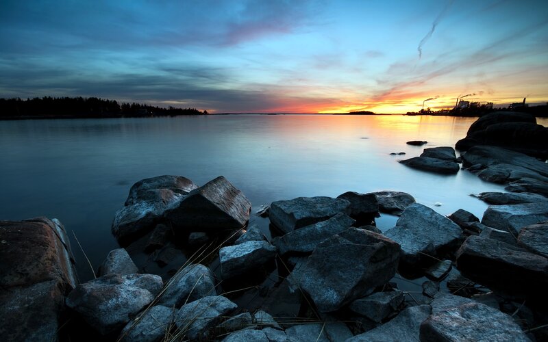 Sunset over rocky shoreline