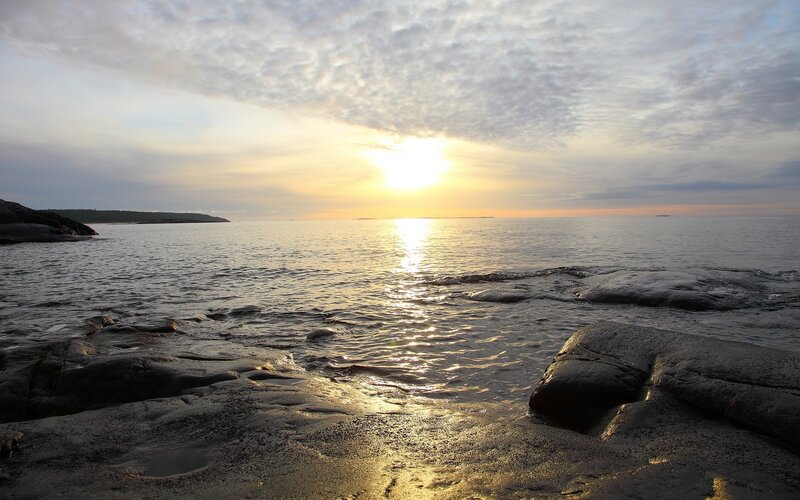 Sunset over rocky shoreline