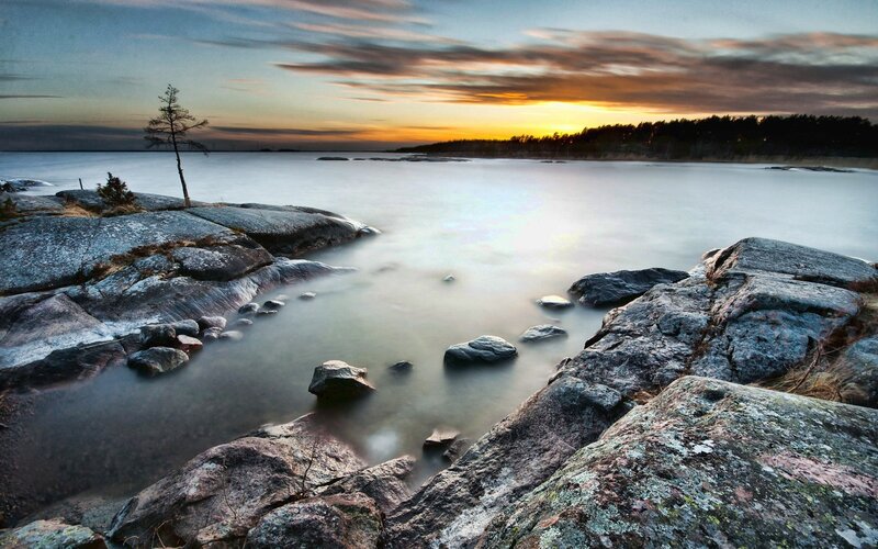 Sunset over rocky shoreline