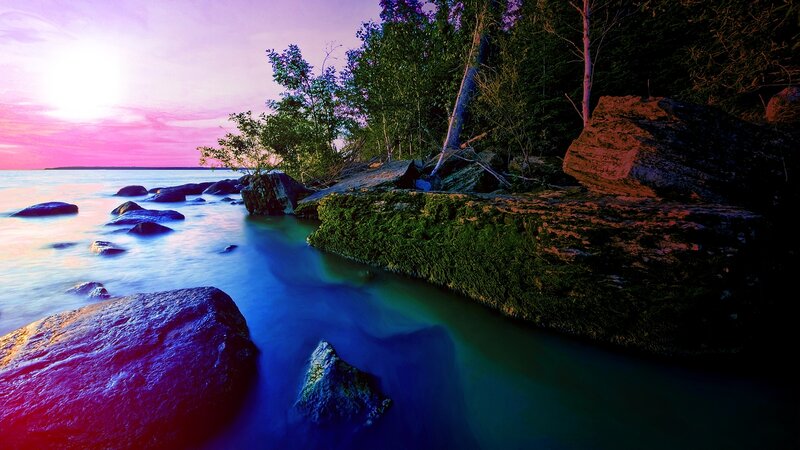 sunset over rocky shoreline