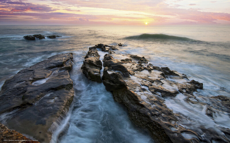 Sunset over rocky shoreline