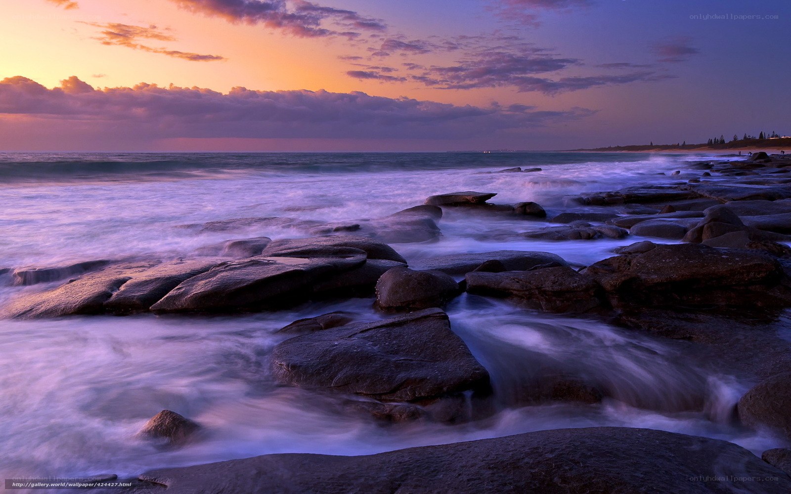 Sunset over rocky shoreline