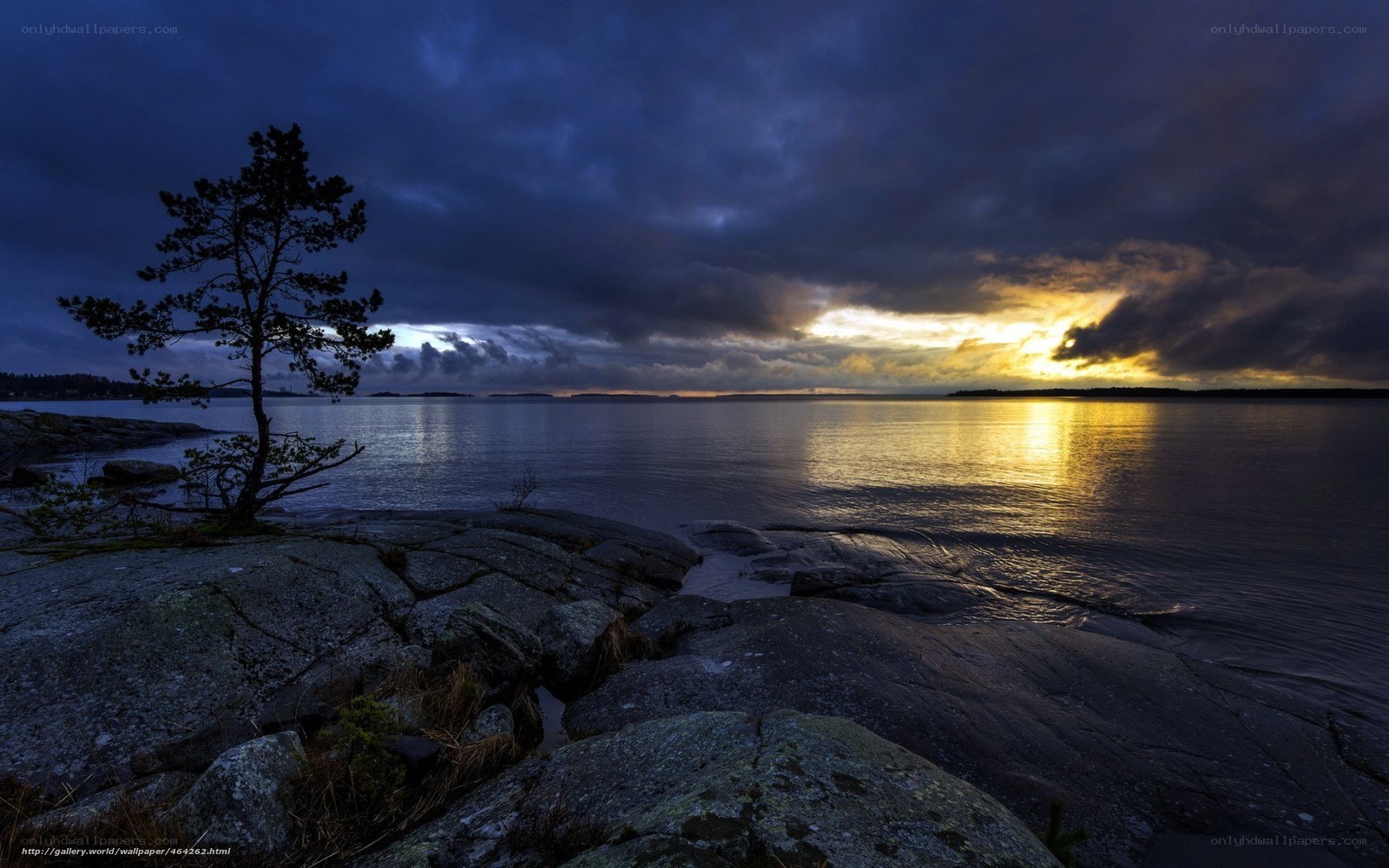 Sunset over rocky shoreline