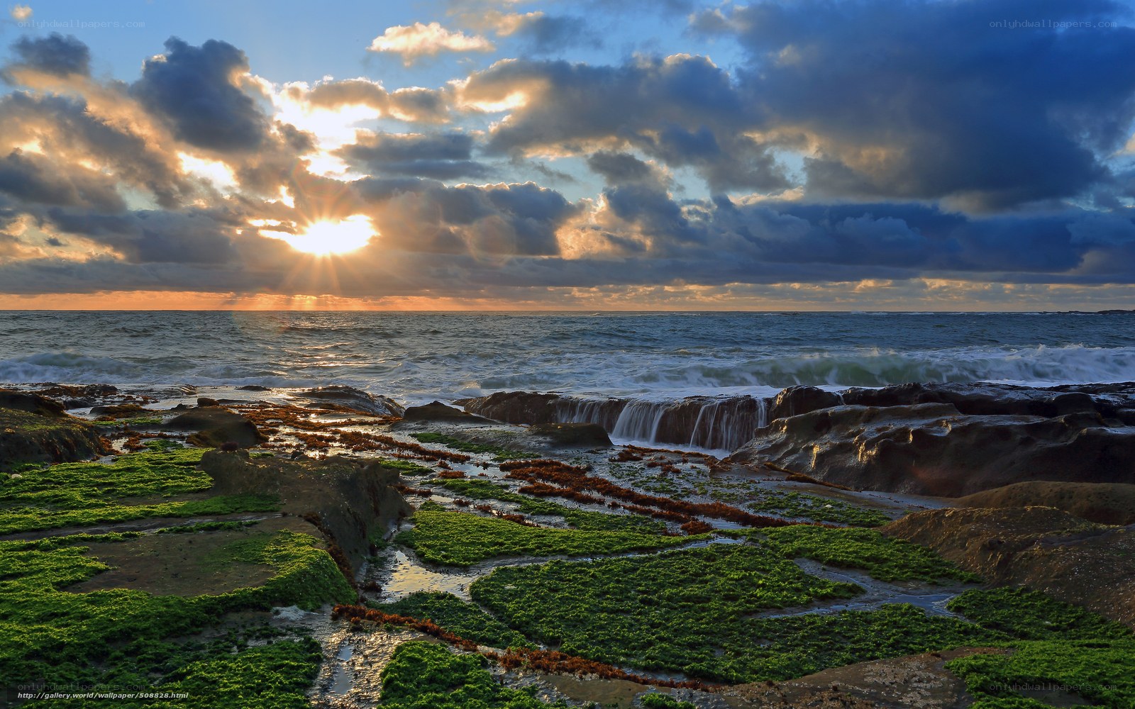 Sunset over rocky shoreline