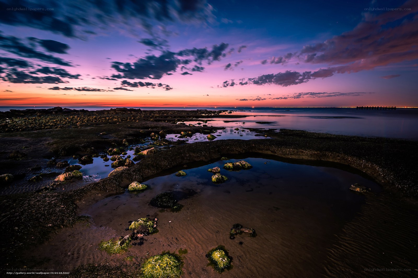 Sunset over rocky shoreline