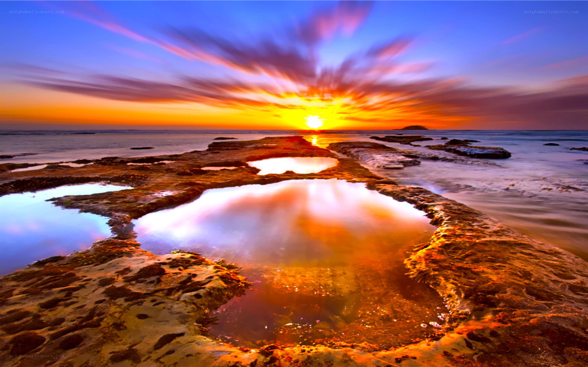 Sunset over rocky tide pools
