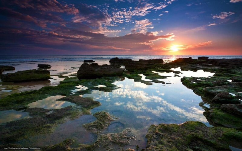 Sunset over rocky tide pools