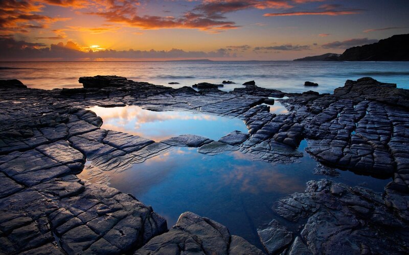 Sunset over rocky tide pools