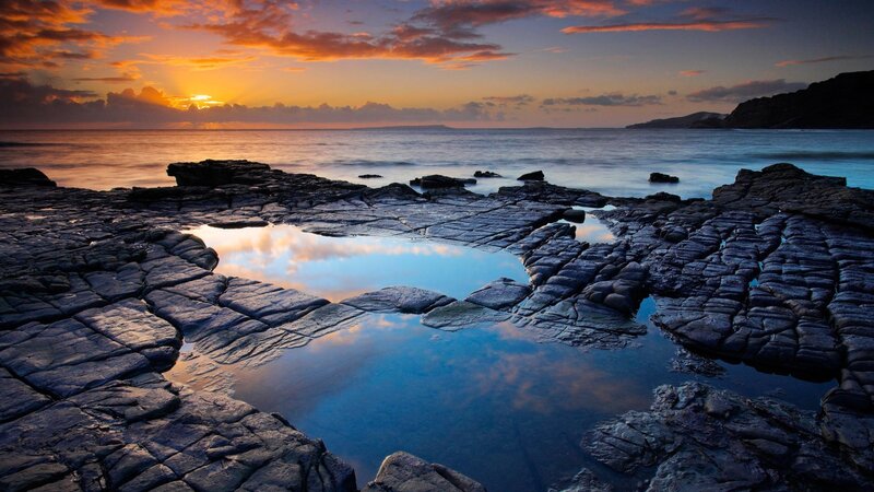 sunset over rocky tide pools