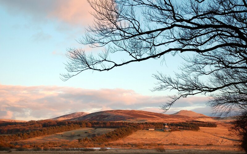 Sunset over rolling hills