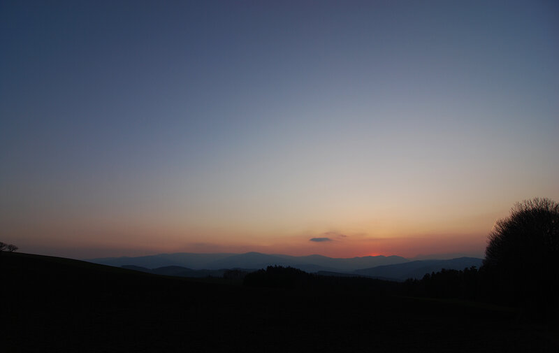 Sunset over rolling hills