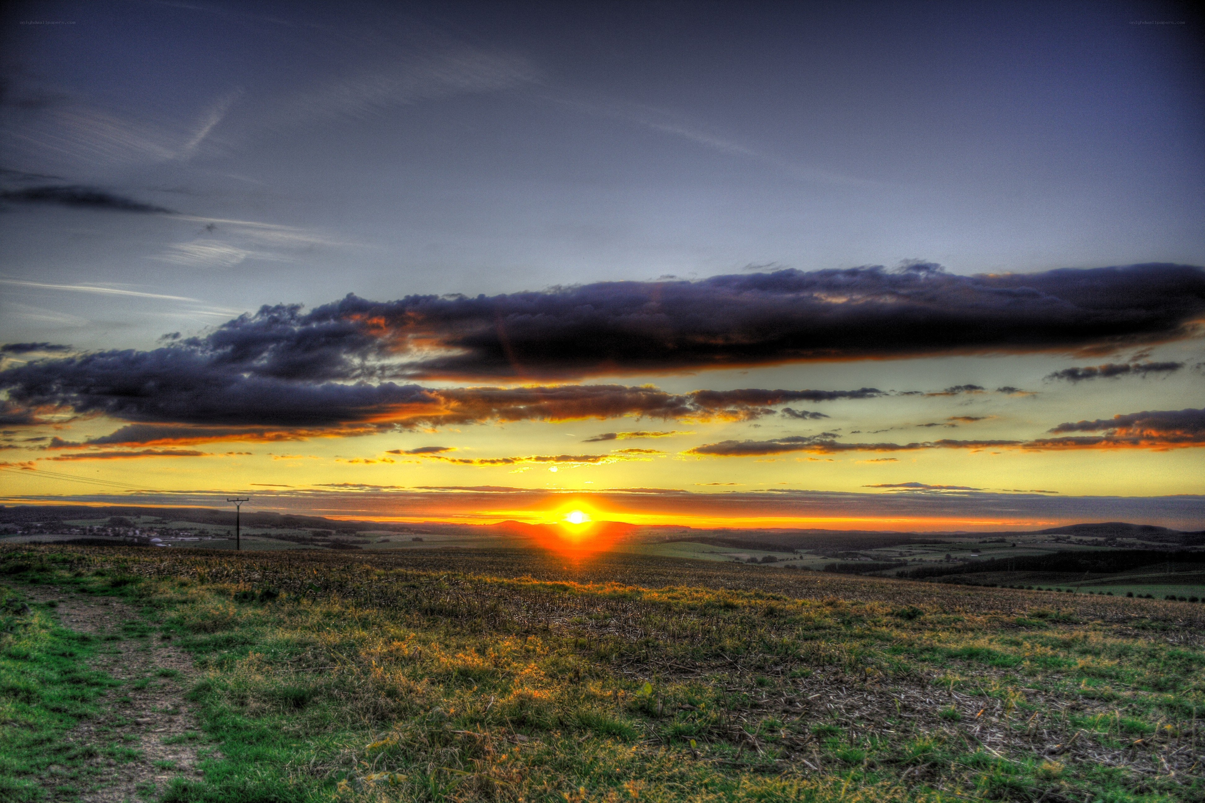 Sunset over rolling hills