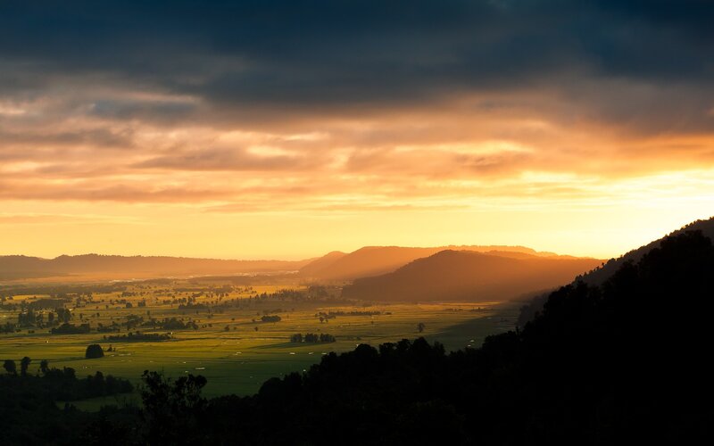 Sunset over rolling hills