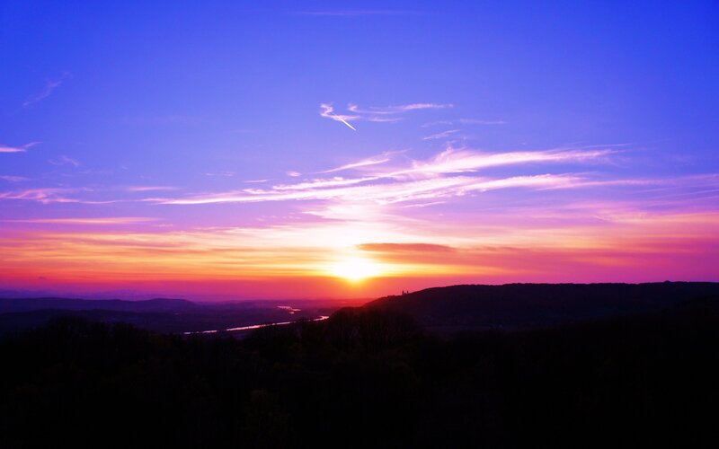 Sunset over rolling hills