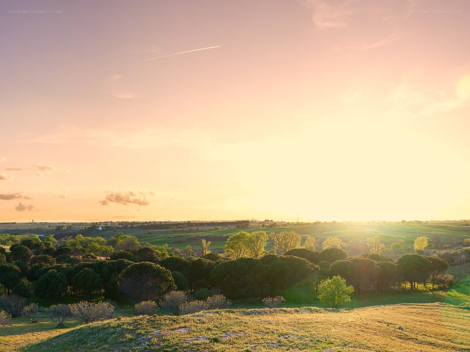 Sunset over rolling hills