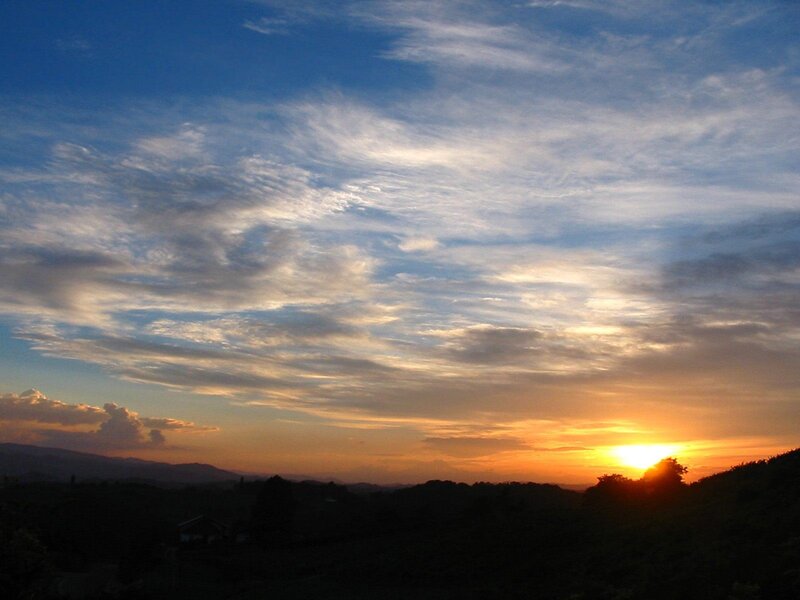 sunset over rolling hills