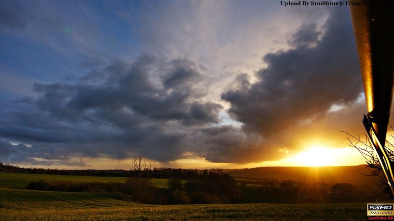 Sunset over rolling hills