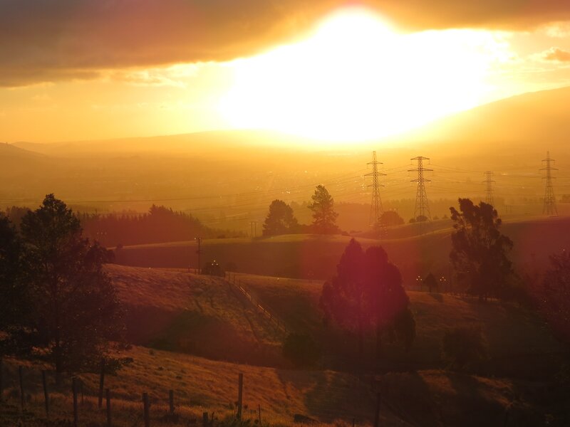 Sunset over rolling hills