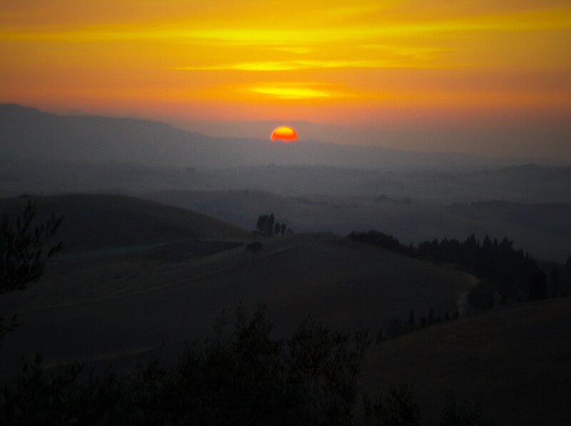 Sunset over rolling hills