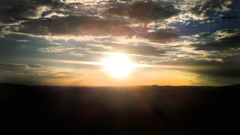 Sunset over rolling hills