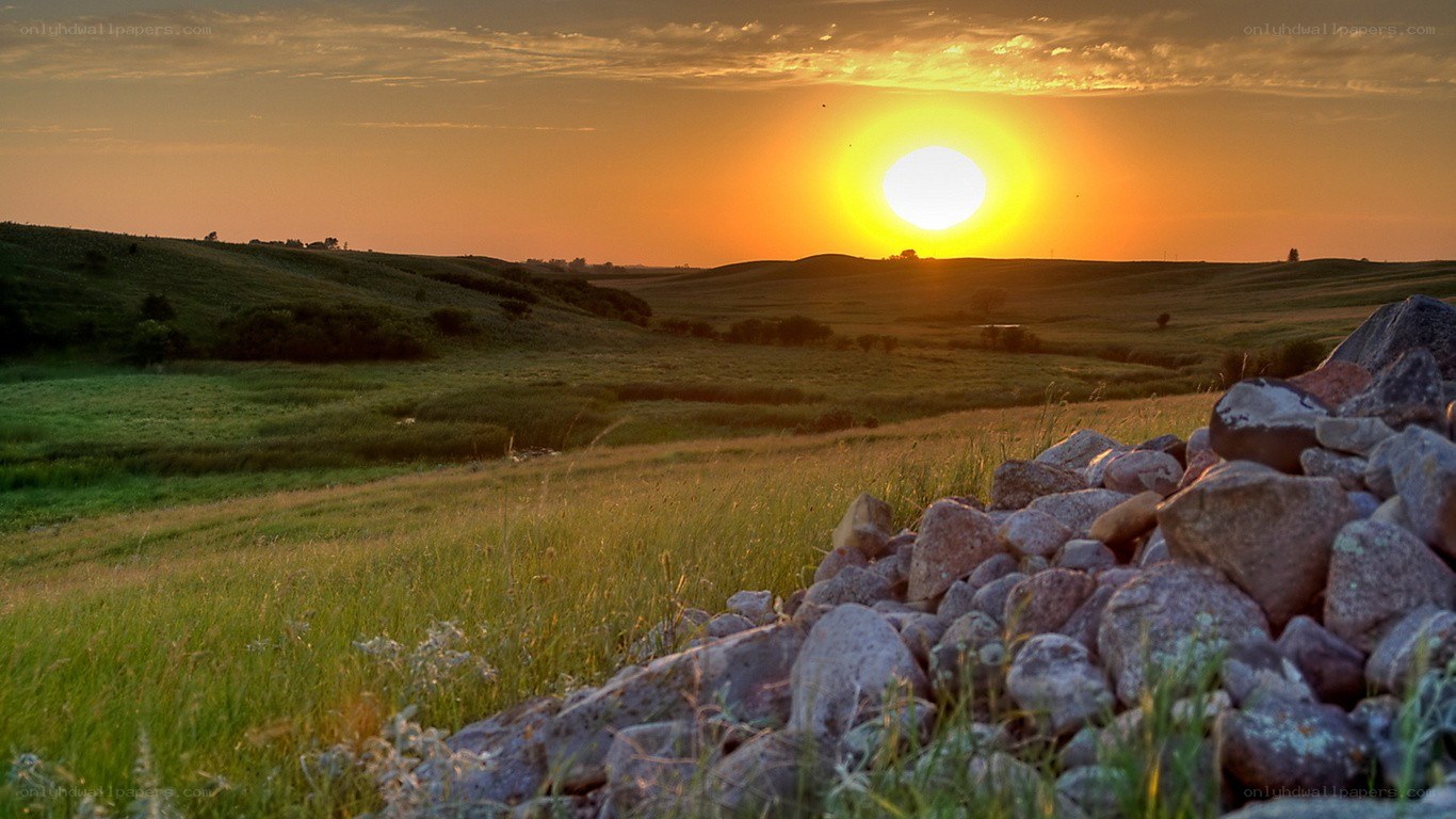 Sunset over rolling hills