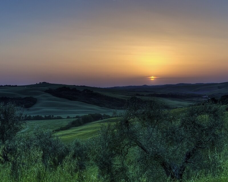 Sunset over rolling hills