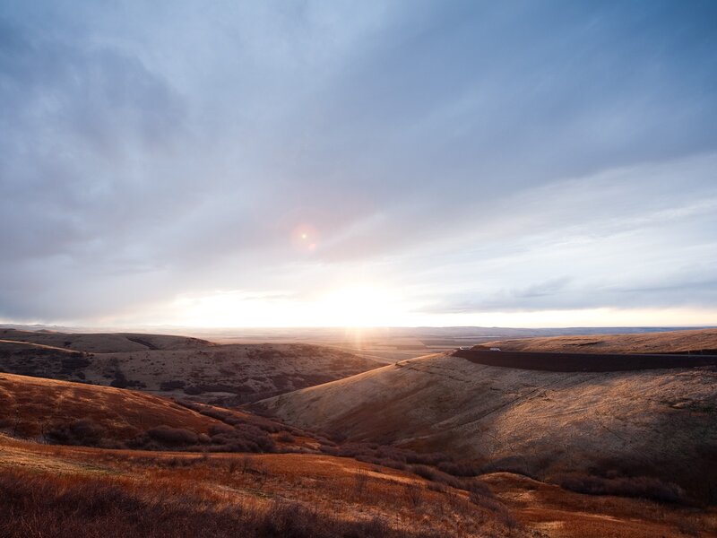Sunset over rolling hills